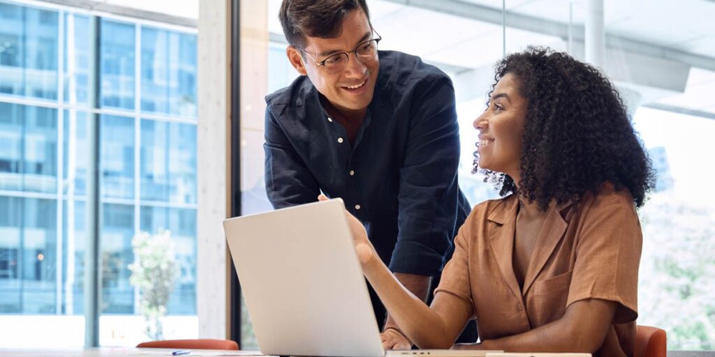man and woman looking at health insurance options